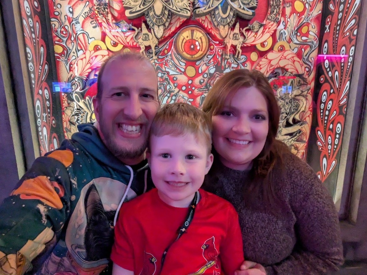 Alec Miller with his wife and son at an arcade