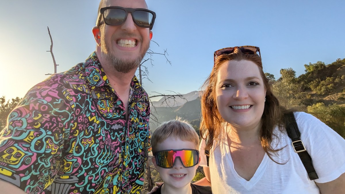 Alec Miller with his wife and son on a hike
