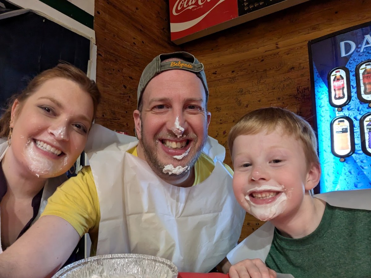 Alec Miller with his wife and son after a pie-eating contest
